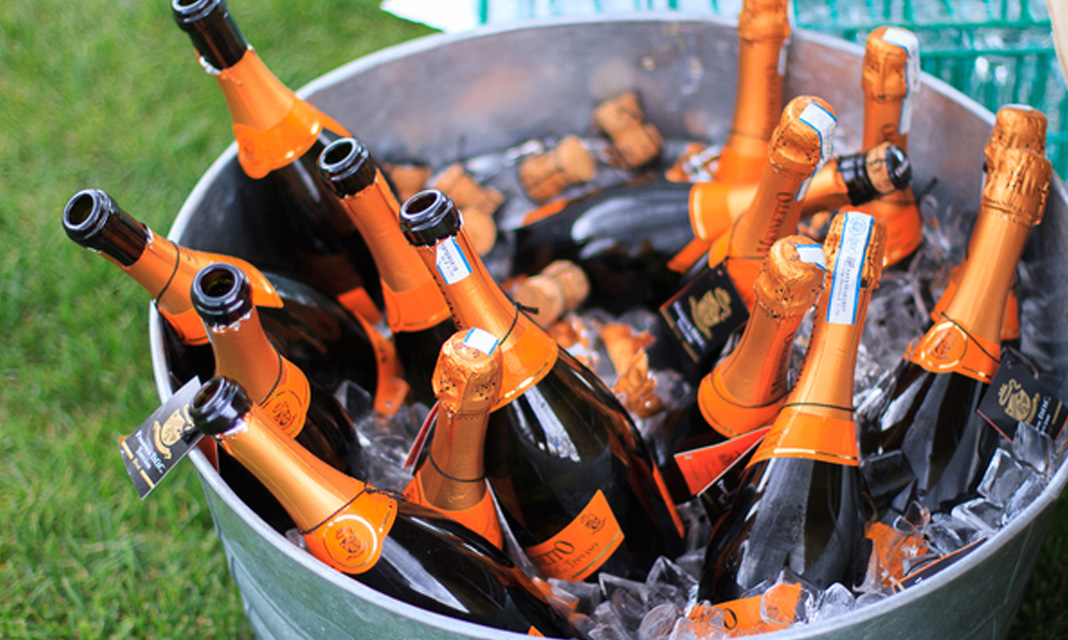 Bottles of sparkling wine chilling in an ice bucket